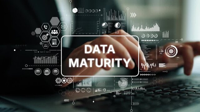 Business Professional Analyzing Data Maturity with Digital Graphs and Icons on Laptop in Modern Office Environment. Asymptotic smart data analytic.