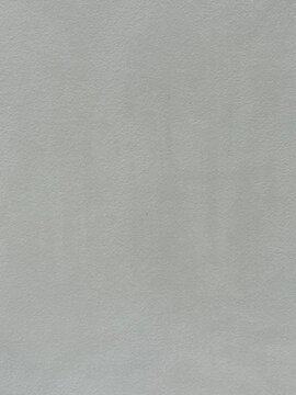 Light gray painted wall texture with subtle surface roughness