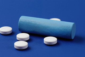 Obraz premium White pills scattered near blue cylinder with CLINICAL TRIAL text. Medical research, drug development, healthcare concepts are represented. This image suits pharma, science, wellness industries.