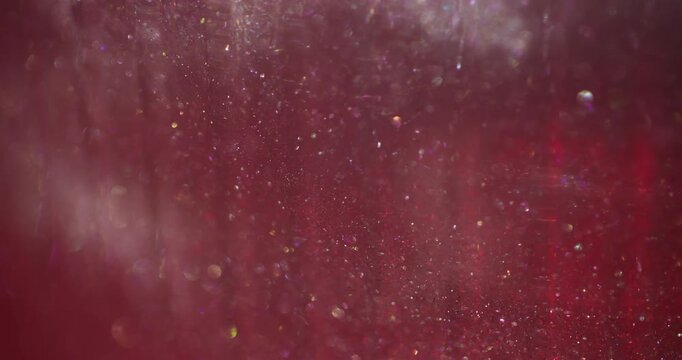 Shimmering defocused flow. Shiny particles glare. Red pink bokeh powder mix flare gradient circles. Color twinkle abstract background.