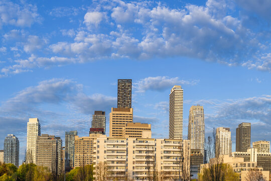 A wide panoramic skyline view of high rise apartment buildings and residential condominium development in the Yonge and Eglinton neighborhood of Toronto Canada