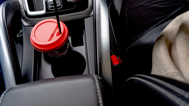 Red lid sits in car's center console