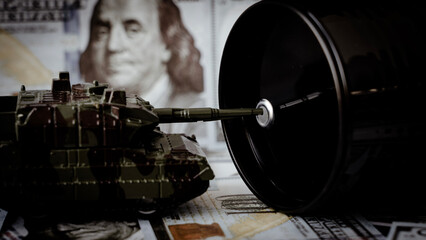 Military tank stands beside oil drum © I