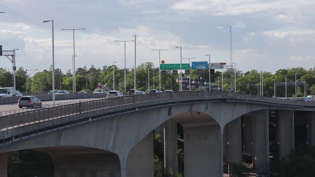 Stockholm, Sweden Traffic on the elevated Essingeleden E4 highway on a sunny day. 