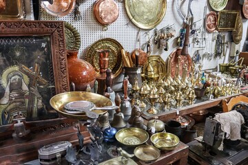 Authentic Antique Shop Interior with Vintage Cypriot Copperware Religious Icon and Flea Market Treasures in Cyprus © Alla