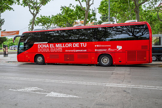 Badalona, Spain - May 24, 2026: Side view of donation bus