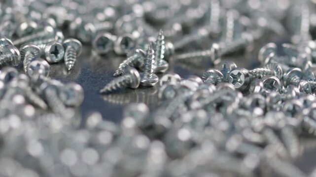 Metal screws for fastening equipment. Soft focus. Close-up. 