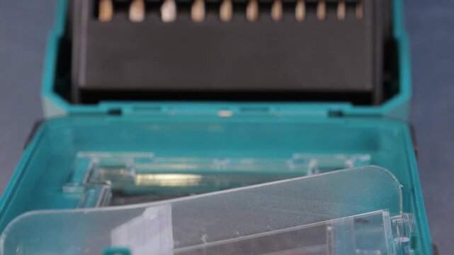 A set of drills for drilling metal in a plastic case.