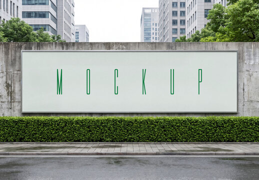 Large horizontal outdoor billboard mockup on a concrete wall in an urban city street with green bushes and office buildings background