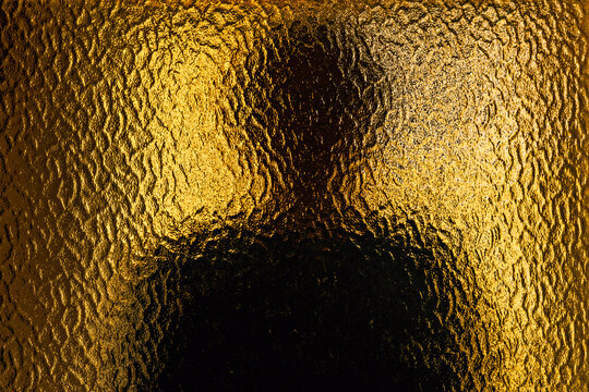 Silhouette of female person behind frosted glass, mental health and social alienation concept in moody light
