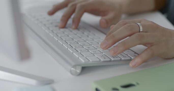 Woman Typing on White Keyboard &ndash; Close-Up Office