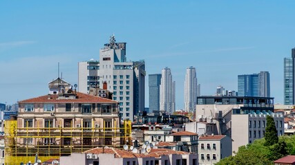 Obraz premium Istanbul, Turkey - May 19, 2026: Panoramic view of Istanbul, Turkey, showing the city skyline, buildings, urban neighborhoods, rooftops, and scenic cityscape.