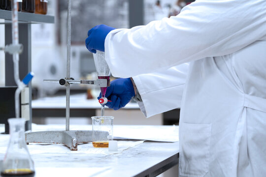 A scientist is conducting an experiment in a flask in a laboratory
