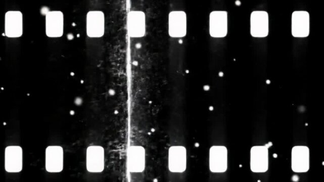 Extreme macro video of luminous white dust, random speckles, and vertical film scratches drifting on a deep black background with film grain. Vintage film overlay concept