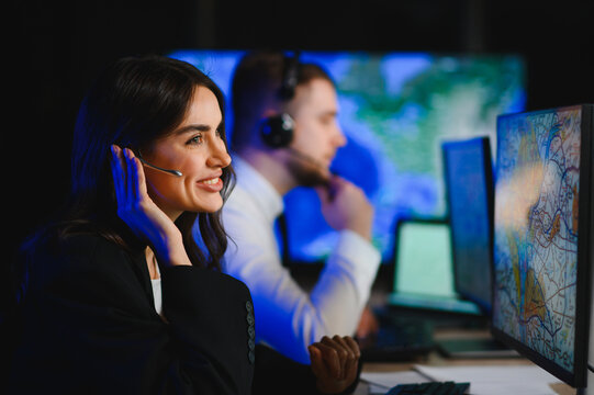 Woman dispatcher monitoring air traffic control systems