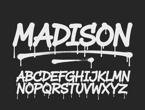 White graffiti spray paint font MADISON and alphabet on black background bold