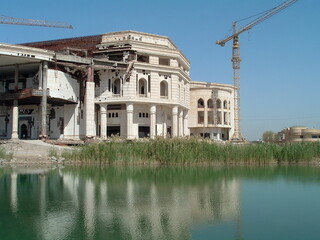 Fototapeta premium Crane over an unfinished Republican Guard palace on Victory Base in Baghdad, Iraq, during Operation Iraqi Freedom