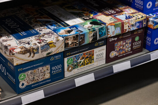 Wroclaw, Poland- February 27 , 2026. Large Trefl jigsaw puzzle boxes of nine thousand pieces are displayed on supermarket shelves. Board games department, home hobby and leisure gaming