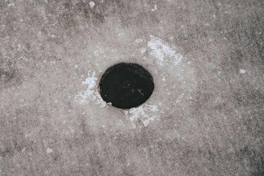 Close-up of an ice fishing hole in P&auml;rnu