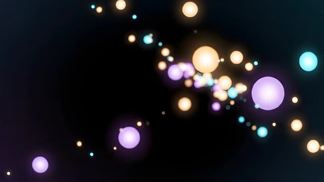 Abstract bokeh background with colorful floating glowing particles.