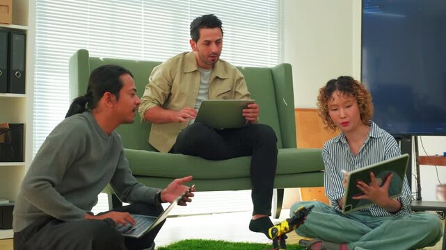 Tech Startup Team Working with Laptops on Robotics and Coding Project Group of Software Developers and Engineers Collaborating in Modern Office