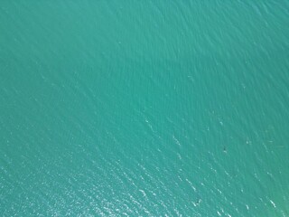 Top down view of aqua colored water with small waves © Tom