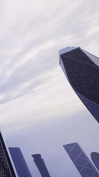 Tall buildings stand in a cityscape under gray clouds. The architecture is unique. The scene captures urban life. Skyscrapers rise high into the sky.