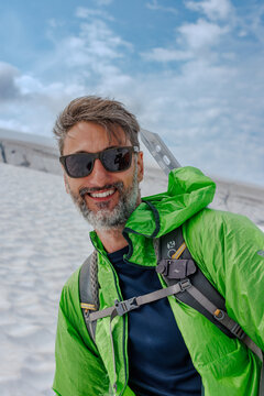 Man on glacier with hiking equipment