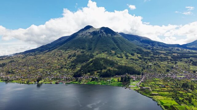 Breathtaking aerial footage of the imbabura volcano and yahuarcocha lake in northern ecuador