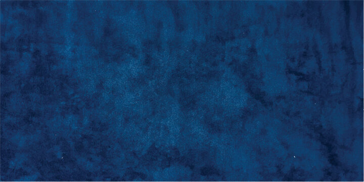 An old dark blue grunge concrete wall texture with a rough black stone surface and vintage paper pattern creates a blank dirty backdrop for a weathered design