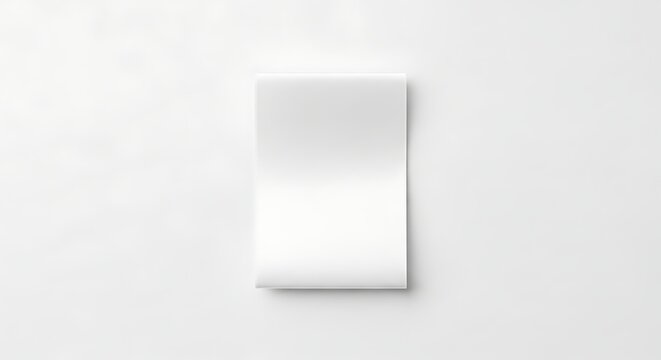 Blank folded clothing care label mockup isolated on surface for custom laundry instructions and garment branding space