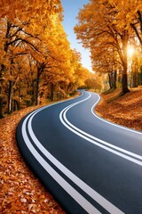 Fototapeta premium Winding road through golden autumn trees with sunlight filtering over a quiet curved highway