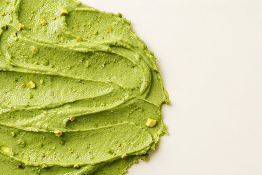 Green Pistachio Cream Texture on white background.