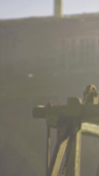 A person is on a wooden structure in low light. The surrounding area has a warm glow. The individual appears to be observing the environment. It is evening time and quiet.