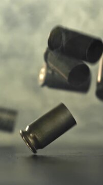 Bullet casings are pressed on the table. Filmed on a high-speed camera at 1000 fps. High quality FullHD footage