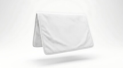 Naklejka premium Isolated folded white picnic mat or camping blanket mockup for branding design presentation with fabric texture