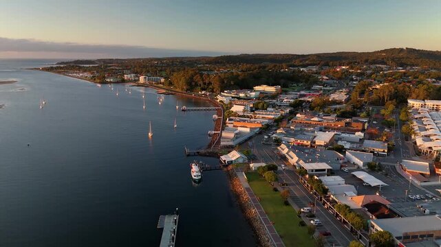 Panoramic aerial drone view of Batemans Bay on the NSW South Coast, Australia, looking out to the coastline and Tasman Sea on a sunny early morning in May 2026   