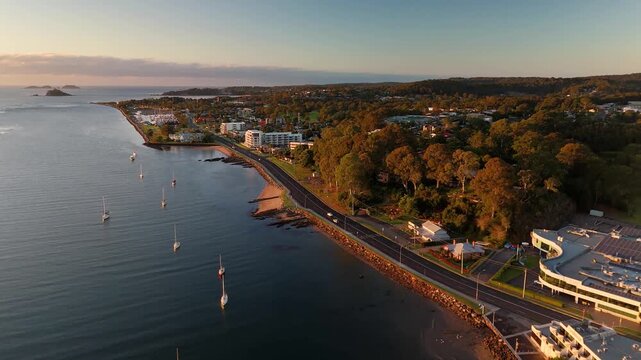 Panoramic aerial drone view of Batemans Bay on the NSW South Coast, Australia, looking out to the coastline and Tasman Sea on a sunny early morning in May 2026   

