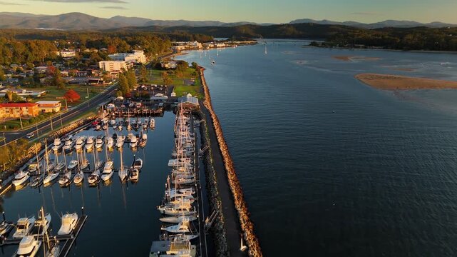 Aerial drone view of Batemans Bay on the NSW South Coast, Australia, looking to Clyde River Bridge and the CBD on a sunny early morning in May 2026   