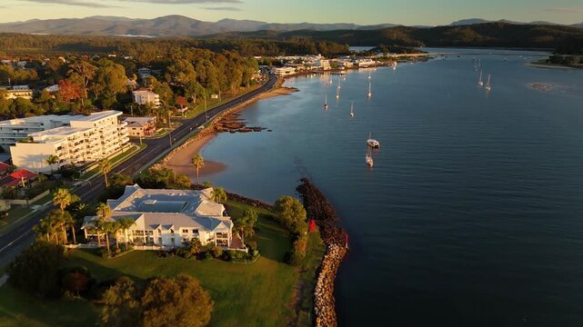 Aerial drone view of Batemans Bay on the NSW South Coast, Australia, looking to Clyde River Bridge and the CBD on a sunny early morning in May 2026   