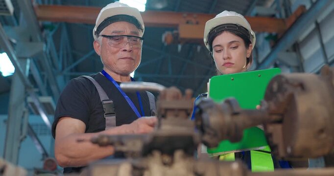 Father Shares Factory Know-How as Daughter Takes Notes in Family Business Transition