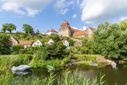 View across the moat to St. Mary's Cathedral, Havelberg, Saxony-Anhalt, Germany