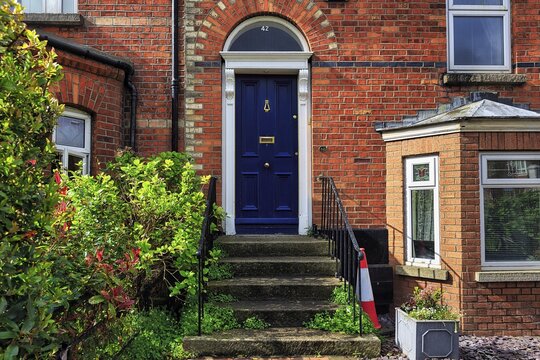 Blue door, house entrance with stairs, typical terraced house, Dublin, Ireland