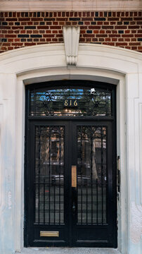 Elegant Black Double Door with Iron Grillwork at Number 816