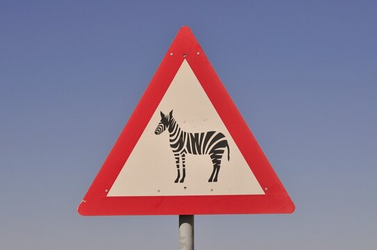 Warning sign for zebras at the entrance of the NamibRand Nature Reserve, Namib Desert, Namibia, Africa