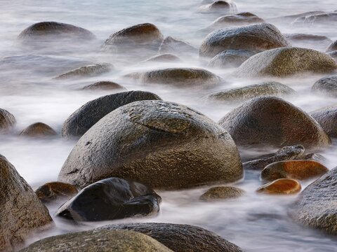 Close-up, rounded rocks on the beach at Utakleiv, Vestv&aring;g&oslash;ya, Lofoten, Norway
