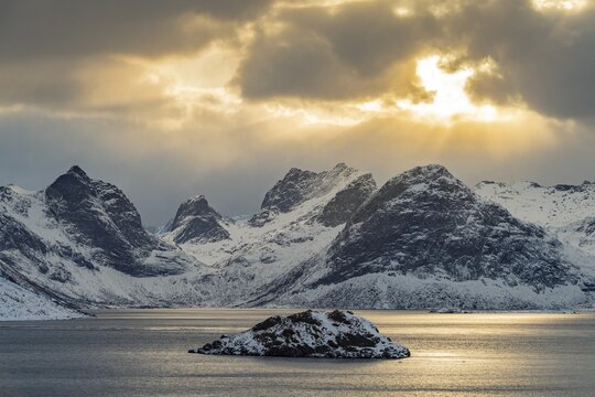 Winter Scandinavian landscape by the fjord, sea, mountains, snow, Ramberg, Nordland, Lofoten, Norway