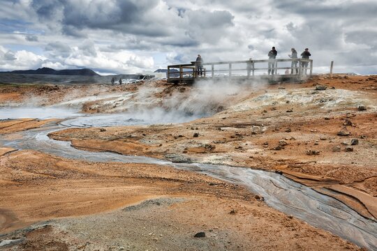 Tourists on viewing platform at steaming mud pot, Hverar&ouml;nd geothermal area, also Hverir, Namaskard or N&aacute;mafjall, M&yacute;vatn, Krafla volcano system, Northern Iceland, Iceland