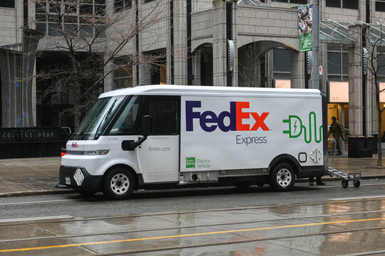 FedEx Electric Vehicle delivering packages in Toronto, Ontario