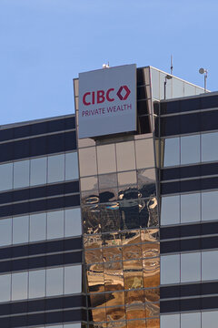 CIBC Private Wealth logo in Toronto against blue sky.